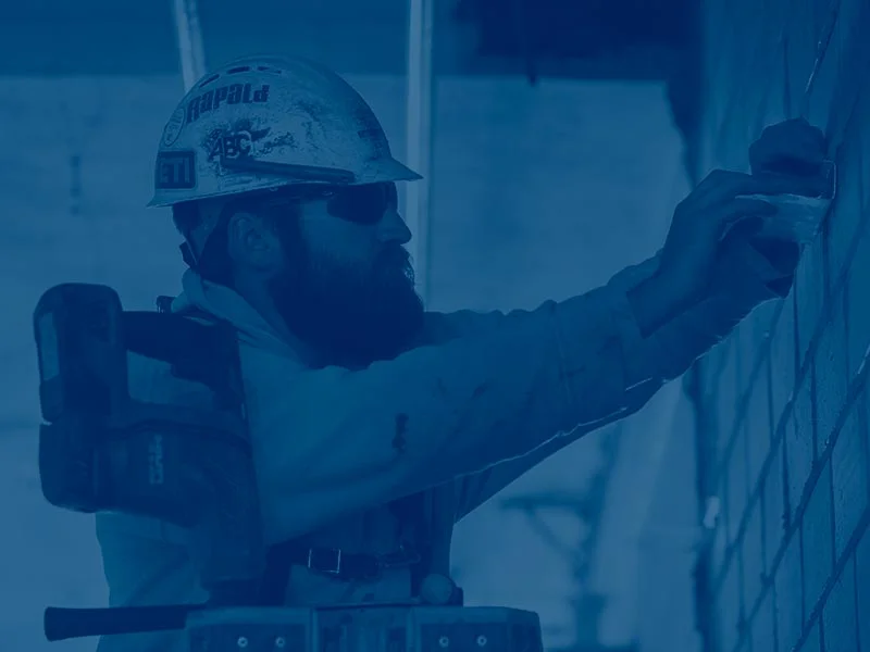 Man working on a wall